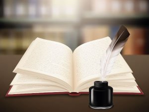 Imagen de un libro abierto con una pluma