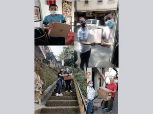Fotografía de familias y equipo de Primaria Incluyente en jornada de entrega de computadores a los beneficiarios del programa